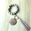 Comercio exterior pulsera personalizada artesanía cuentas de madera talladas llavero disco en blanco borla llavero colgante multicolor opcional