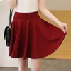 Sexy noir jupes courtes femmes été couleur unie rouge poche taille haute a-ligne Mini femme élégant bureau femme 210708