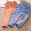 Pantalon décontracté en velours côtelé pour bébé Printemps Automne Vêtements pour enfants Bouton de couleur unie Pantalon pour filles 2-5-8-10 ans 210701