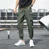 Poches latérales pour hommes Cargo Harem Pantalon Rubans Noir Hip Hop Casual Homme Joggers Pantalon De Mode Streetwear 210715