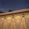 Solar LED Wall Lamp Hollowed Out Projection Lamp Outdoor Lighting Garden Decoration Waterproof Sunlight Powered Lighting