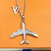 New Arrive Europe America Fashion Men Womens Lady Silvercolour Hardware Engraved V Letter Necklace With Plane Pendant MP31574348096