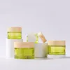 50g Clear Green Glass Jar Flaskor med bambu Korn Plastkeps Face Cream Packaing Container Hushållning T2I52899