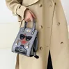 工場出口の女性の皮革ショルダーバッグ漫画のファッションハンドバッグレトロなクロコダイルレディースメッセンジャーバッグストリートトレンドエンボス革ハンドバッグ