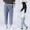 Mäns jeans mens lösa casual raka byxor koreanska hösten tonåringar denim beskuren