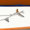 New Arrive Europe America Fashion Men Womens Lady Silvercolour Hardware Engraved V Letter Necklace With Plane Pendant MP31574348096