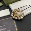 2021 European and American fashion diamond letter brooch temperament trend coat suit accessories female high quality fast delivery