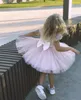 ほこりのピンクの女の子のページェントのドレスボールガウンユニークなデザイナーボウハートの形のキーホールバック子供グリッツの花のための結婚式のサイズ4 6 8 10誕生日パーティー