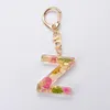 Mode 26 lettres porte-clés fleurs séchées remplissage A-Z initiales en plastique porte-clés femmes filles suspendus pendentif porte-clés