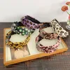 Leopardtryck Knotted Headbands för kvinnor och tjejer Cross knut Head Wrap Fashion Crystal Hair Band Womens Head Band