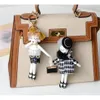 Koreansk stil docka kawaii väska charm hängande prydnad trendiga kedjor mode dam nyckelring handgjorda nyckelring