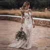 2021 Sheer Bohemian Mermaid Wedding Dresses Jewel Neck Illusion Long Sleeves Lace Appliqued Crystal Beads Backless Beach Boho Bridal Gowns Sweep Train Plus Size