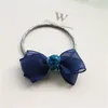 Boutique 40 pcs moda fofo gaze gaze laço elástico faixa de cabelo maciço kawaii lace bowknot titular de rabo de cavalo