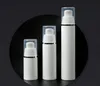 Bouteilles d'emballage de 15ml 30ml 50ml, contenants cosmétiques cylindriques blancs purs à bord argenté, pompe sans air pour émulsion en plastique