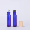 1 3OZ Empty Packaging Glass Roller Cosmetic Bottles Clear Blue Amber Frosted Colors with A and B Metal Ball Plastic Wooden Grain Lids