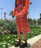ファッション夏の女性自由奔放に生きるビーチカジュアルスタイルのスカート女性のハイウエスト花の印刷オレンジ色のミディスカートパーティー休日の服Y0824
