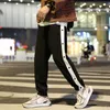 Случайные полосатые брюки мужчины мода хип-хоп уличная одежда свободных брюк баскетбол фитнес спортивные спортивные спортивные спорты