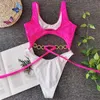 Colysmo Sexy Bikini Swimsuit Women Contrasting Colors Hollow Out Metal Chain Lace Up Monokini Hight Cut Swimwear 210527