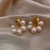 女性のファッションジュエリーの贅沢な結婚式のパーティーの女の子の珍しいイヤリングのためのエレガントな有名人の金属象りの真珠のイヤリング