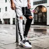 Heren lente zomer jeans Europese en Amerikaanse straatmode stijl slanke stiksels gescheurde casual broek ontwerper potloodbroek