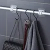 självhäftande duschgardinstångshållare