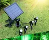 Lampe de projection solaire à LED applique murale extérieure insérée au sol étanche un glisser quatre projecteur de pelouse super lumineux