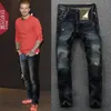 Jeans retrò americani europei cuciture da uomo vecchie toppe da mendicante pantaloni lunghi dritti sciolti locomotiva di marca di moda di personalità