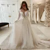 długa sukienka ślubna z rękawem