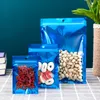 1000ピース/ロットブルーの再封鎖可能な臭い防止のジッパーロックアルミホイルの袋袋のクリアフロントハングホールの食品貯蔵のための包装袋