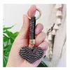 Mode Läderband Rhinestone Heart Ball Keychain Kvinnor Tjejväska Charms Pendant Trinket Härlig söt bil nyckelring gåva llaveros J0306