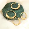 Pendientes de aro Huggie de acero inoxidable con geometría hueca a la moda 2021 simples chapados en oro para mujer, joyería de diseñador de tendencia