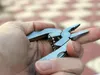 Tragbares Multifunktionsklappzabler Edelstahl Foldaway Messer Keychain Schraubendreher Camping Survival EDC Tools Travel Kits HW612