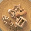 4 sztuk / zestaw zabawek dla niemowląt Naturalne bukowe drewniane grzechy ząbkowanie gryzoni pierścień muzyczny urodzony prezent montessori wózek zabawki 220216