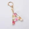 Colorful A-Z Initials Key Chain Dried Flowers Filling 26 Letters Plastic Keychain Women Girls Hanging Pendant Keyrings Gifts