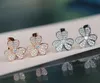 V or Boucle d'oreille clip fleur de qualité luxueuse avec tous les diamants de couleur platine et plaqué or rose 18 carats pour les femmes bijoux de mariage gif