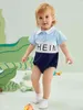 Body à col polo pour bébé avec lettres graphiques et blocs de couleurs SHE