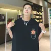 Verano dibujos animados bolsillo impreso hombres moda camiseta algodón suelto Casual Harajuku manga corta Chic hombre