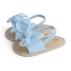 Sandales Baby Girls Bow yunt Cute Summer Soft Sole Flan Princess Shoes Младенческая Нескользящая первые ходунки падение