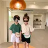 Estilo coreano crianças moda unisex cor sólida camisas de manga curta camisas meninos meninas soltas solteiras tops 210615
