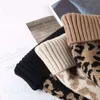 Autumn /winter hair ball knitting hat fashion leopard grain curl edge wool hats European and American personality keep warm cap ZC501