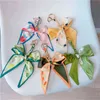 Scarf Bowknot Keycain för kvinnor Flickor Elegant bilring Ljus fruktfärg Butterfly Bow Key Chain Creative Bag Pendant Smycken