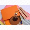 Luxury design M69317 Flower REVERSE KEY HOLDER BAG CHARM Designer Accessory Keyholder Keyring Car Key Bell Keychain ID Name Tag Holder Hot Stamping Stamp