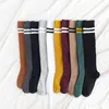 Nova abertura feminina moda joelho altas meias japonês escola estudantes inverno outono quente cor sólida alta qualidade baixo preço y1119
