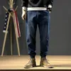 Jeans masculinos estilo japonês moda homens solto ajuste emendado designer calças de carga hombre harem streetwear hip hop joggers271o