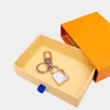 Nouveau alliage serrure conception astronaute porte-clés accessoires designer porte-clés solide métal voiture porte-clés boîte-cadeau emballage