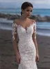 Sexiga Scoop Långärmade Sjöfrökta Bröllopsklänningar Abito da Sposa Sweep Train Lace Bridal Gown Champagne och Elfenbenstrand Boho Bröllopsklänning