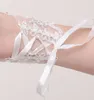 Nya ankomst Brudhandskar spetsar applikationer pärlor fingerfri handledslängd med band brudhandskar bröllopstillbehör