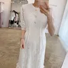 Korejpaa Women Dress Summer Korean Fashion Elegant Hollow Lace Hook Flower Trim Pearl Button-up White Short Sleeve Dresses 210526