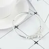 Charmarmband caoshi utsökta kvinnors silverfärg justerbar med ihåliga klockor boll modefest kvinnlig smycken dagligen samling