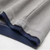 Polo di marca Aoliwen camicia a maniche corte tinta unita cuciture colore casual Polo da uomo top abbigliamento di alta qualità uomo 210707
